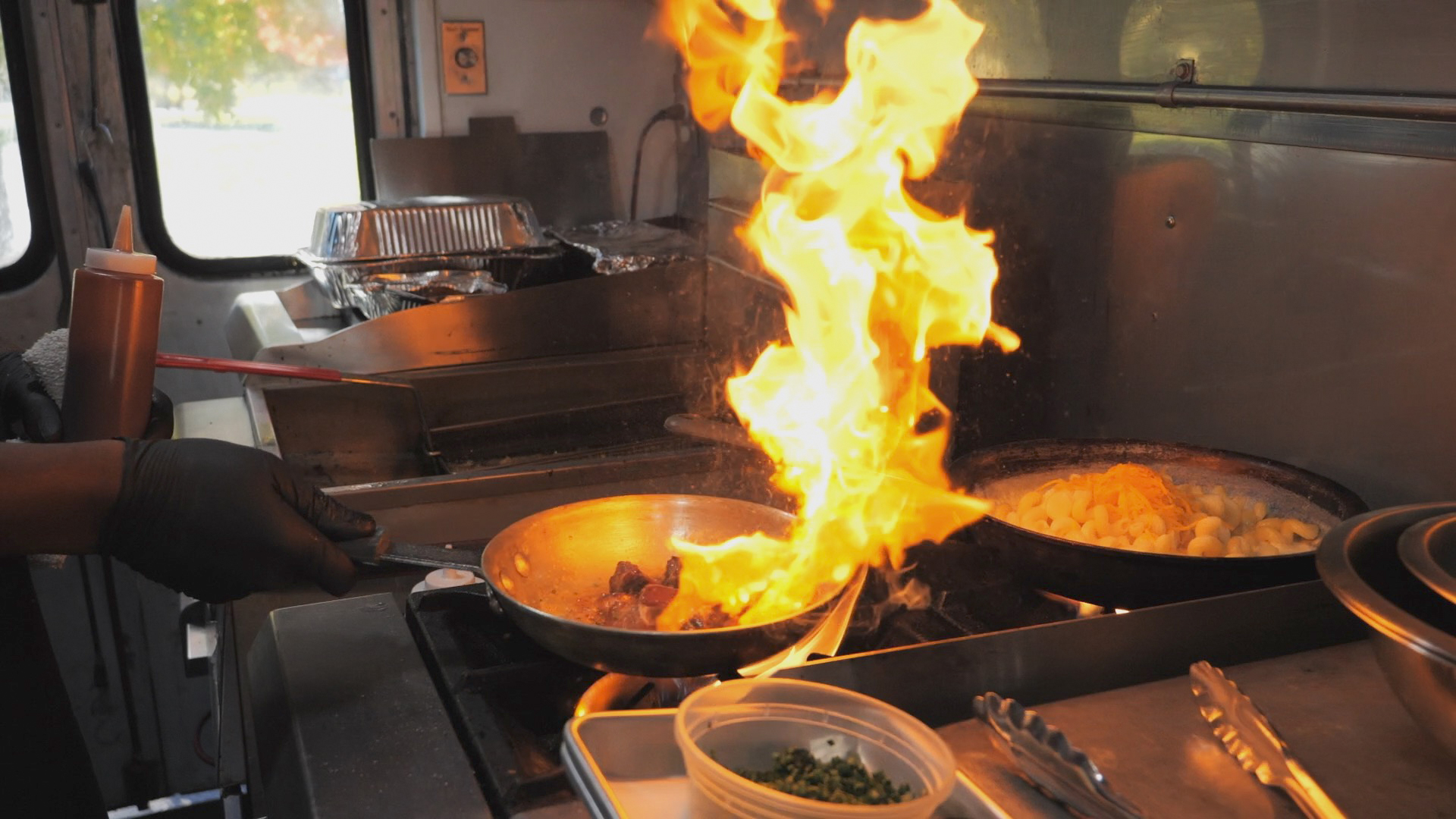 A saucepan erupts in flame